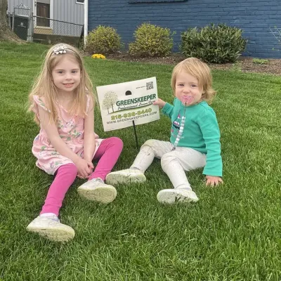 Greenskeeper kids in grass