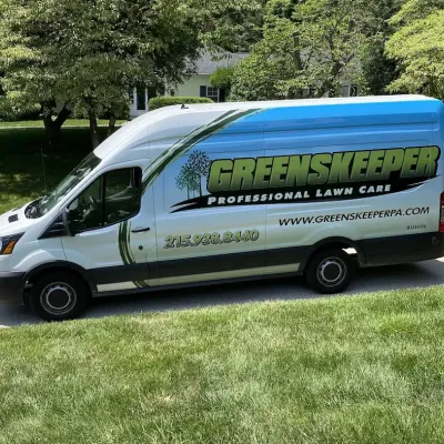Greenskeeper Company truck in front of green lawn